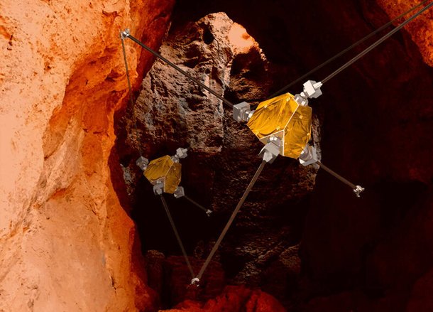 Robô rico explora uma caverna subterrânea em Marte.  show do leão